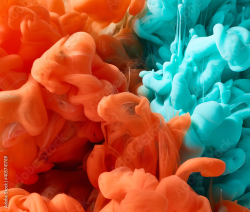 Blue and orange abstract ink splash background.