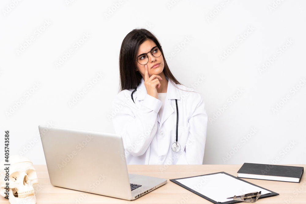 Professional traumatologist in workplace thinking an idea Professional traumatologist in workplace thinking an idea