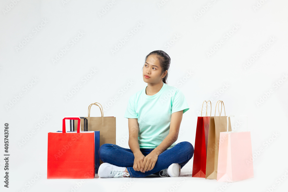 Young girl with lot of shopping bags feeling upset
Young girl with lot of shopping bags feeling upset