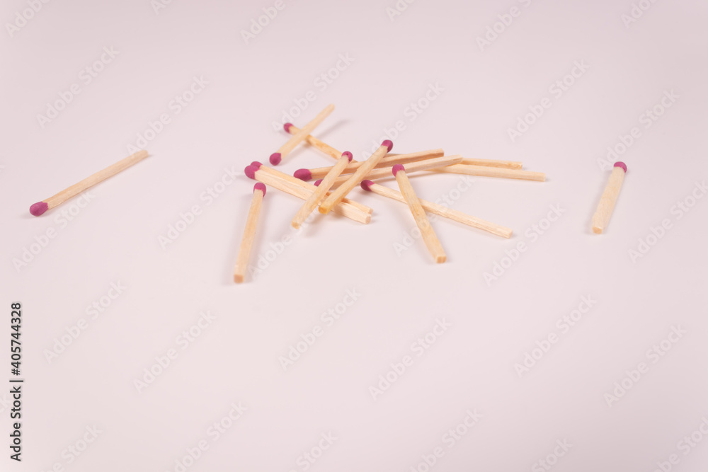 a pile of matches and two matches on opposite sides