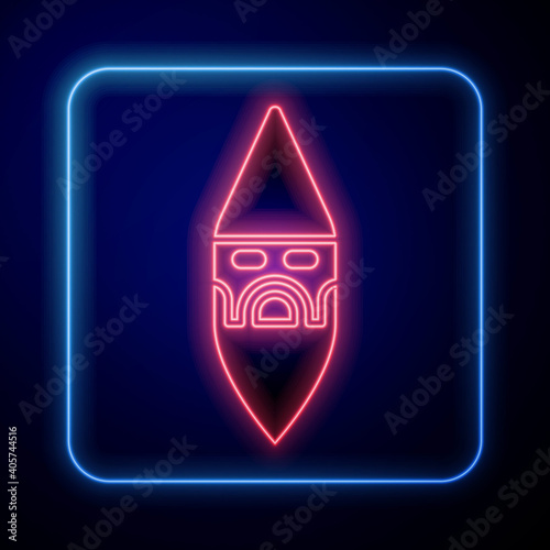 Glowing neon Wizard warlock icon isolated on blue background. Vector.