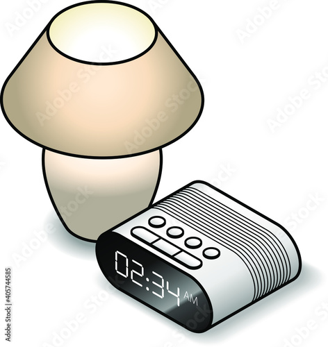 A bedside lamp with a clock radio.
