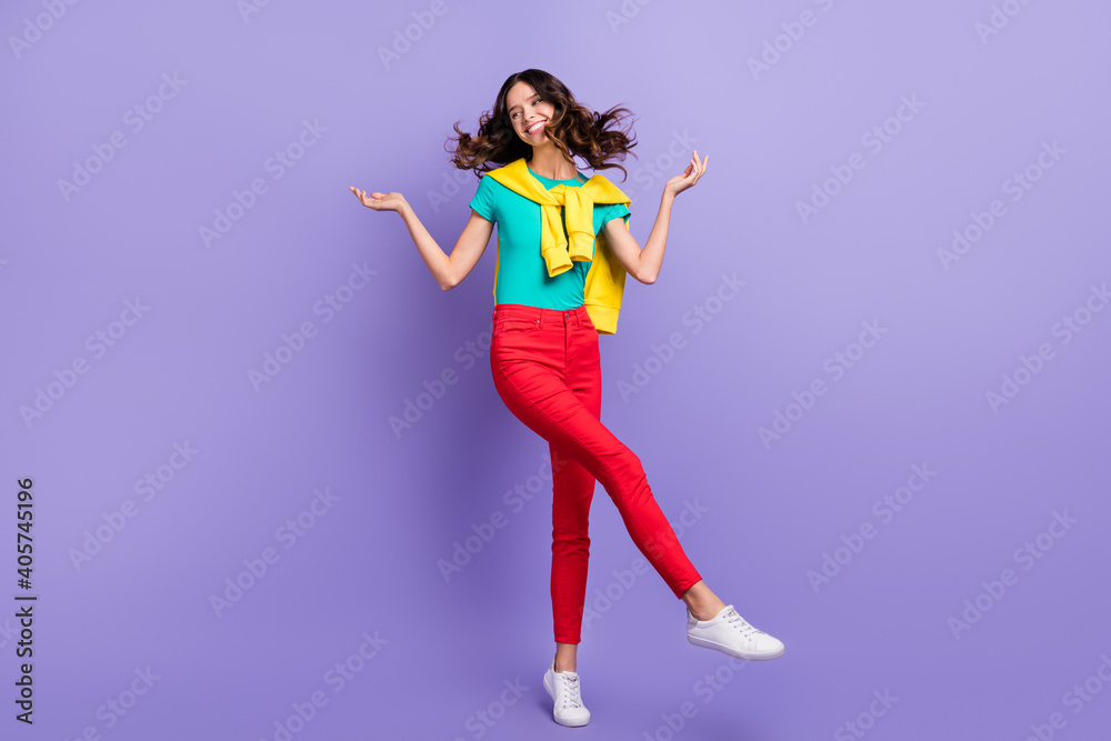 Full length photo of sweet pretty curly young lady wear sweater shoulders dancing isolated violet color background