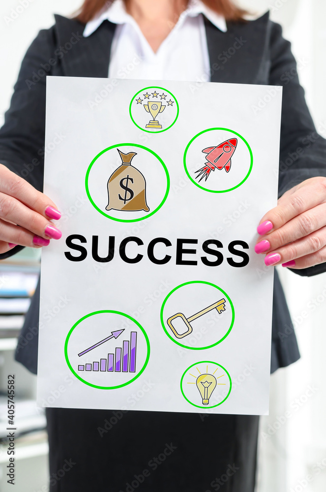 Success concept shown by a businesswoman Success concept shown by a businesswoman