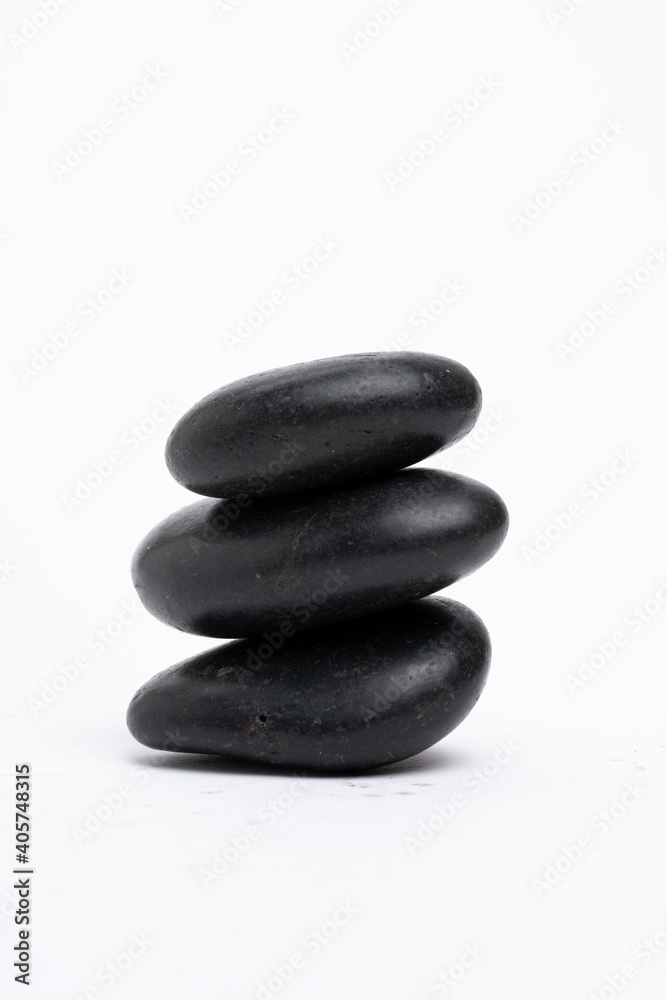 Zen concept: stones arranged against white background Zen concept: stones arranged against white background