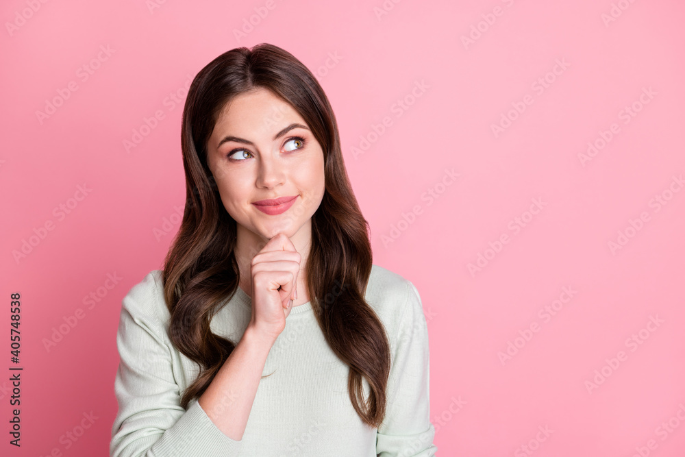 Portrait of dreaming person arm on chin look interested empty space isolated on pink color background Portrait of dreaming person arm on chin look interested empty space isolated on pink color background