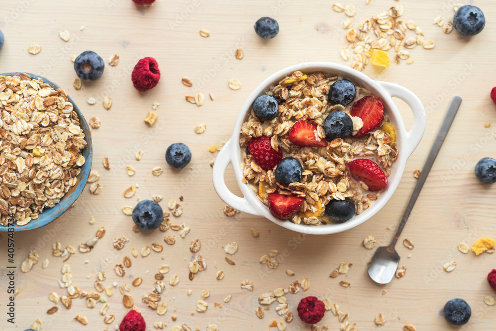 Muesli from oatmeal, berries view from above. Easy morning breakfast with granola Muesli from oatmeal, berries view from above. Easy morning breakfast with granola