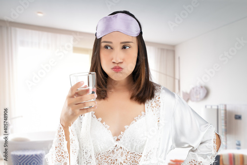 Quadro em tela Asian woman rinsing your mouth with water after brushing after waking up