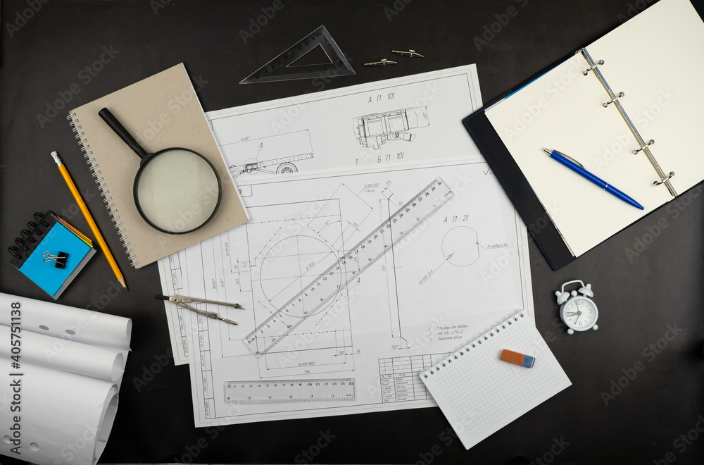 Sketching supplies. Work desk for architect, designer, engineer. Ruler pencil, notepad magnifying glass, eraser. Notebook with place for text. View from above. Sketches Sketching supplies. Work desk for architect, designer, engineer. Ruler pencil, notepad magnifying glass, eraser. Notebook with place for text. View from above. Sketches