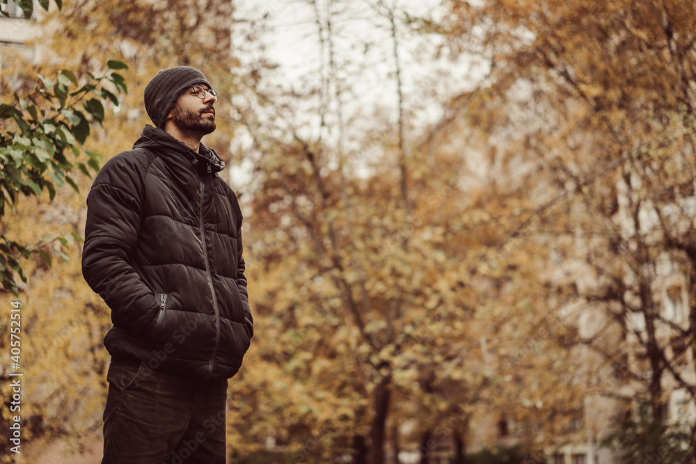 Autumn fall vibes. young male man standing in park Autumn fall vibes. young male man standing in park