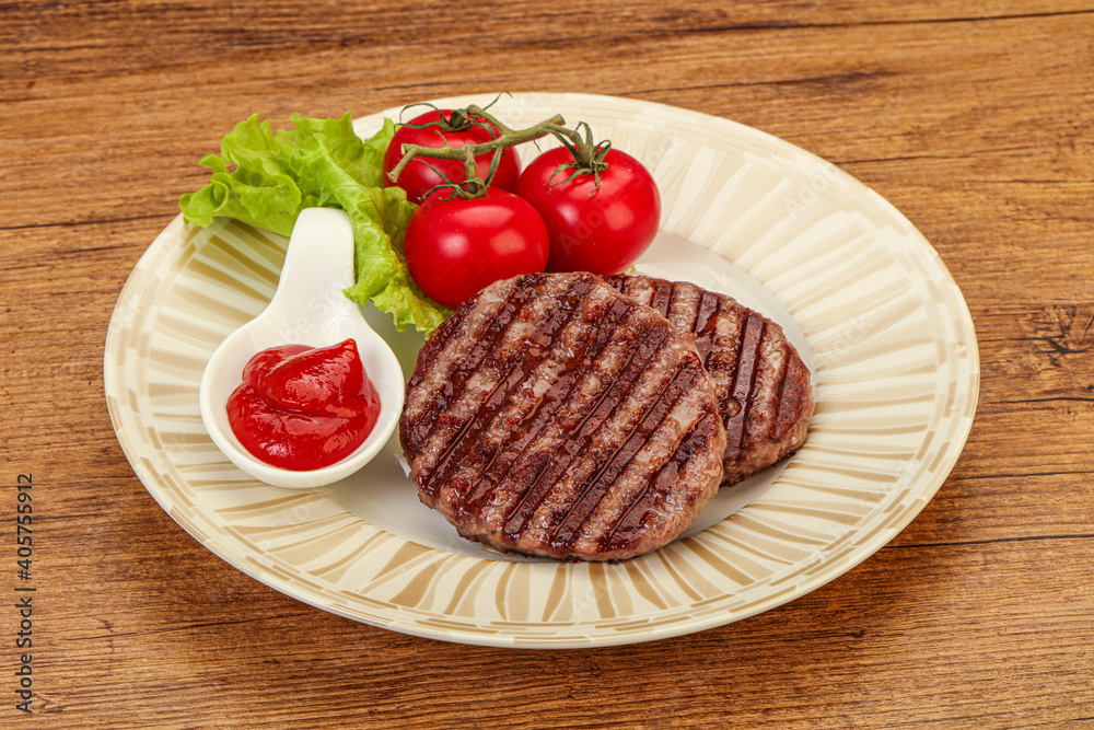 Grilled burger cutlet with sauce