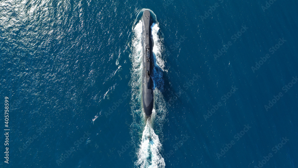 Naklejka premium Aerial drone photo of latest technology armed diesel powered submarine cruising half submerged deep blue sea