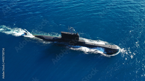 Aerial drone photo of latest technology navy armed diesel powered submarine cruising half submerged photo