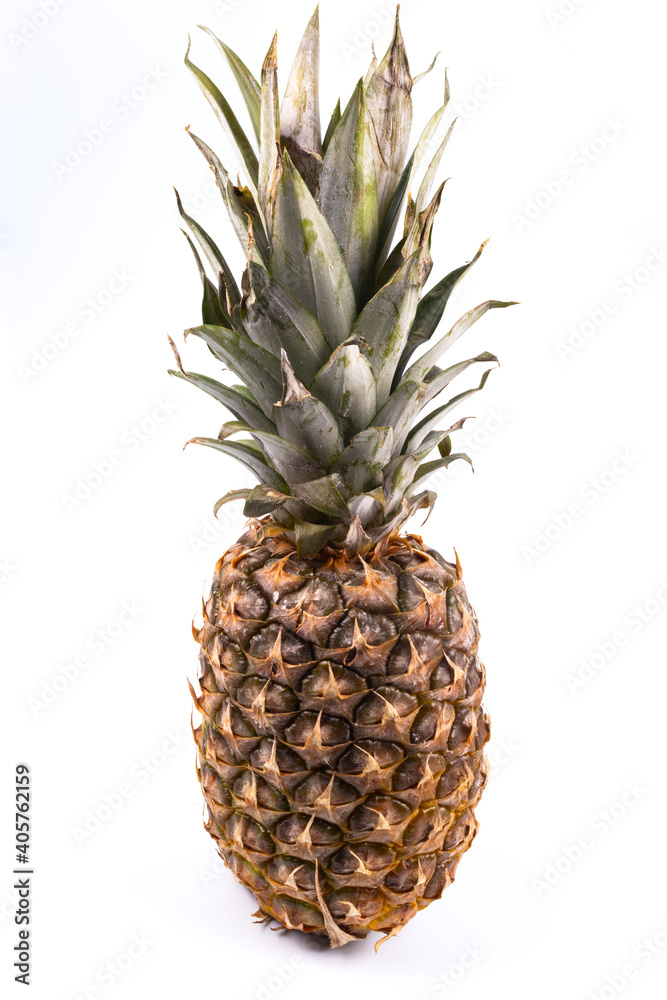 vertically located pineapple and greens and fruit are visible vertically located pineapple and greens and fruit are visible