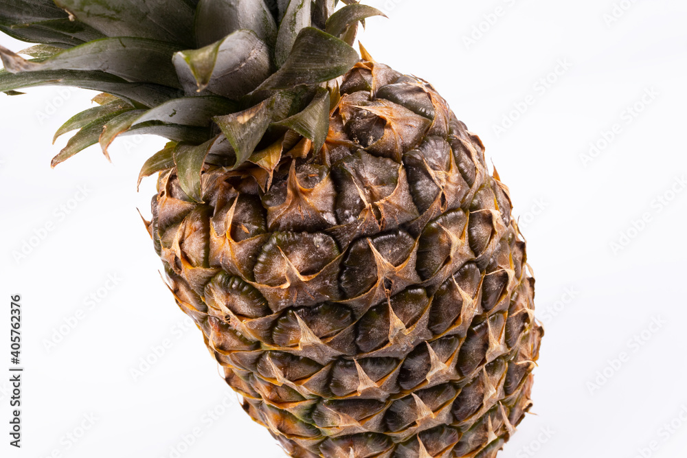 ripe pineapple close up on white background