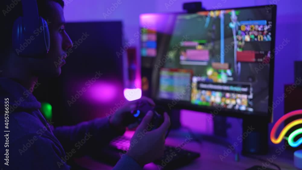 Young gamer playing online video games while streaming on social media - Youth people addicted to new technology game