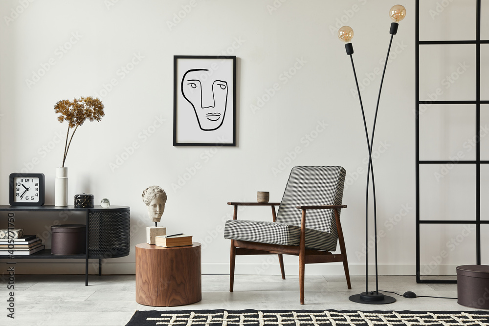 Stylish scandinavian composition of living room with design armchair, black mock up poster frame, commode, wooden stool, book, decoration, loft wall and personal accessories in modern home decor. - obrazy, fototapety, plakaty 