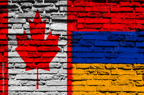 Flag of Canada and Armenia on brick wall