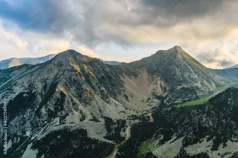 Cloudy sunset over the mountains (Ulldeter, Pyrenees Mountains, Vallter 2000, Spain)