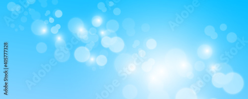 Blurred light sparkle elements. Glitters isolated on blue background.