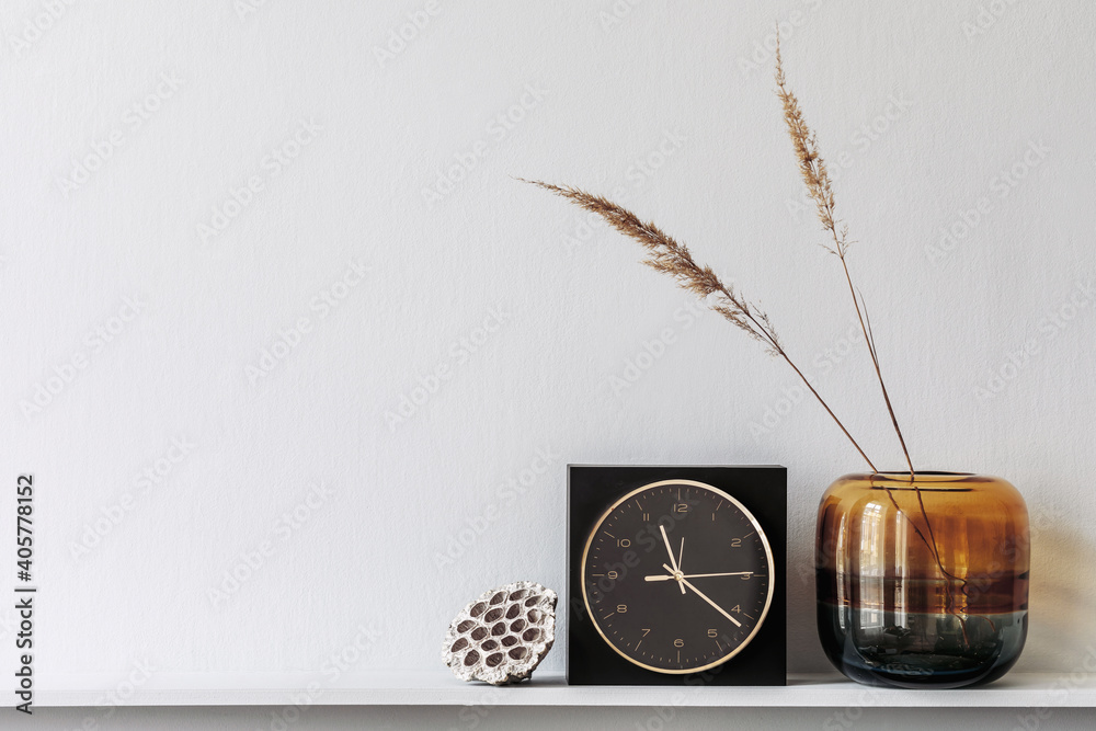 Minimalistic composition on the wooden shelf with dried flowers in vase and elegant personal accessories in stylish living room interior. Copy space. - obrazy, fototapety, plakaty 