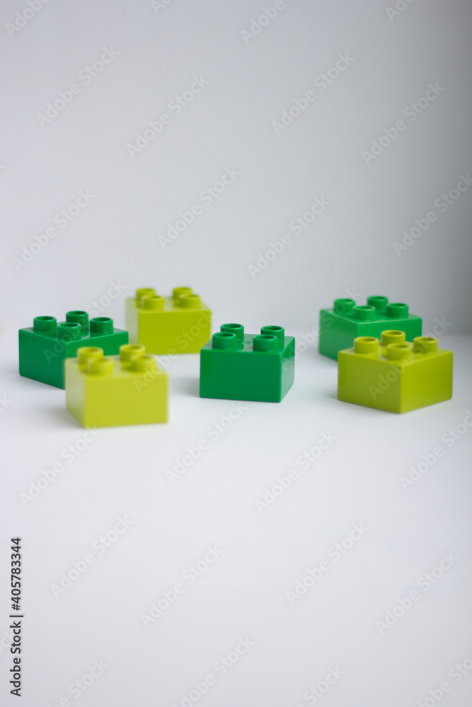 Naklejka premium blocks. Children's constructor.Details are green on a white background.
