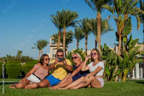 Real people concept, beautiful family, two teenage girls, mother and father happiness and nice body for enjoyed people live an lifestyle, smile and walk together in vacation. Doing selfie