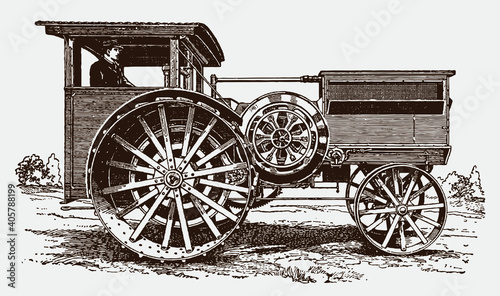 Man from the early 20th century driving an antique tractor