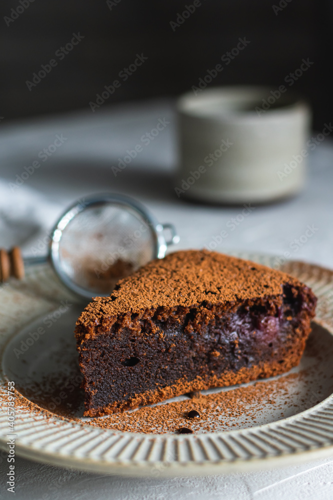 Chocolate cake with cherry on a plate