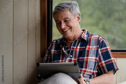 Senior man using digital tablet
