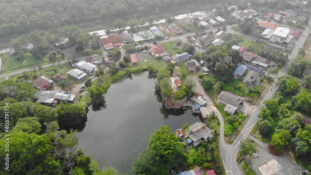 Aerial View Of Garden In Kuala Selangor With Green Trees And A Large Pond - Pan Right To Left 