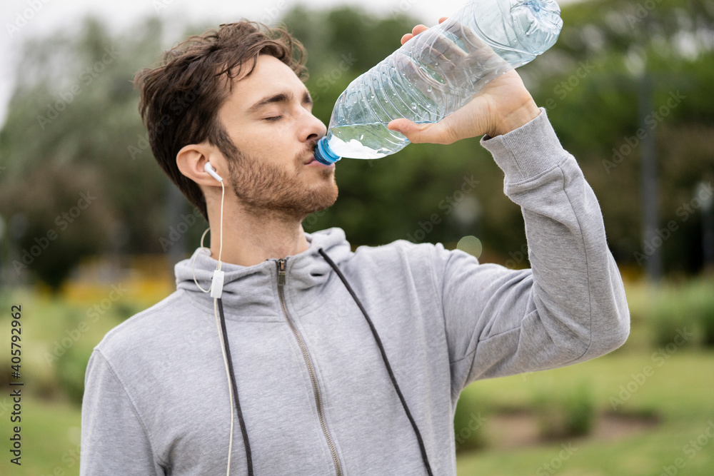 Young man drinking water