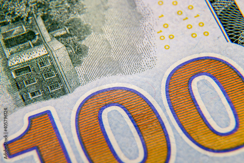 Close-up macro shot of a 100 dollar bill. American money, the currency of Americaю