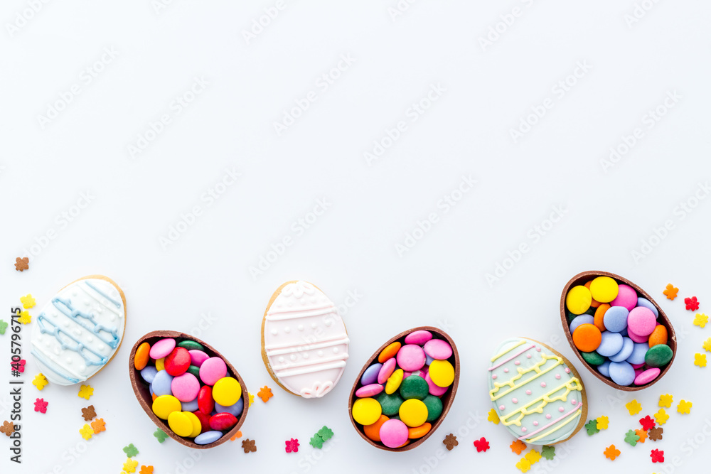 Happy Easter with chocolate eggs and sweets, top view Happy Easter with chocolate eggs and sweets, top view
