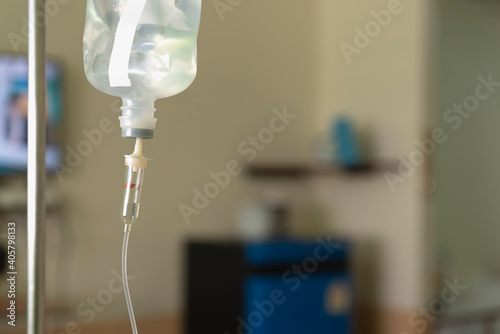 Close up   saline solution drip for the patient at the hospital ward.