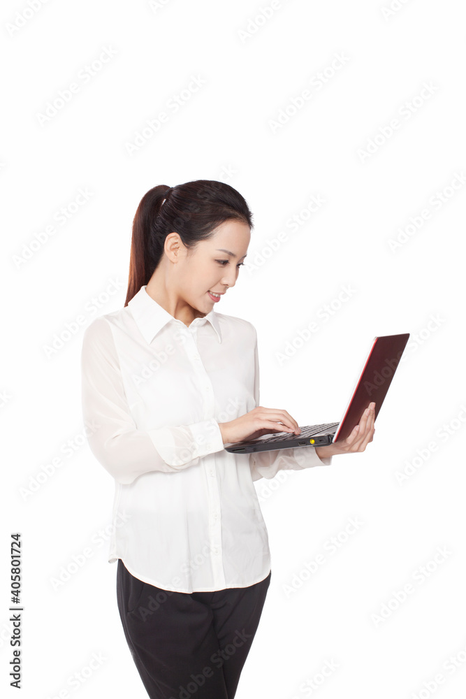 Smiling a young business woman using laptop 