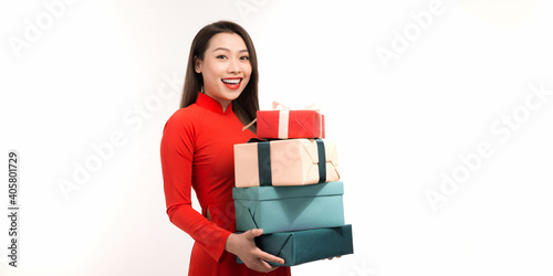 Woman in vietnamese tranditional costume hold with gift box