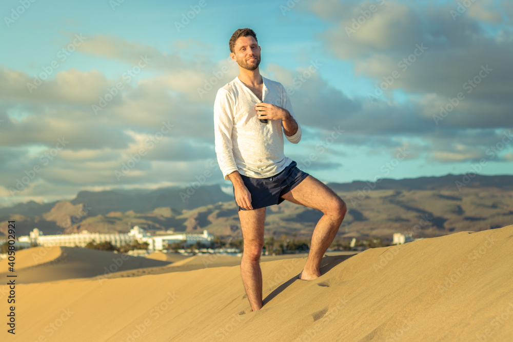 Man in the dunes in Maspalomas in Gran Canaria during sunset