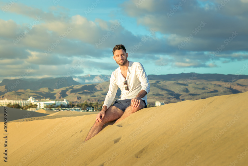 Man in the dunes in Maspalomas in Gran Canaria during sunset