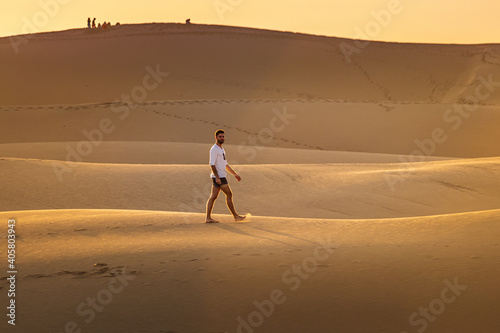 Young man walking in the runes in Gran Canaria in Spain during Covid