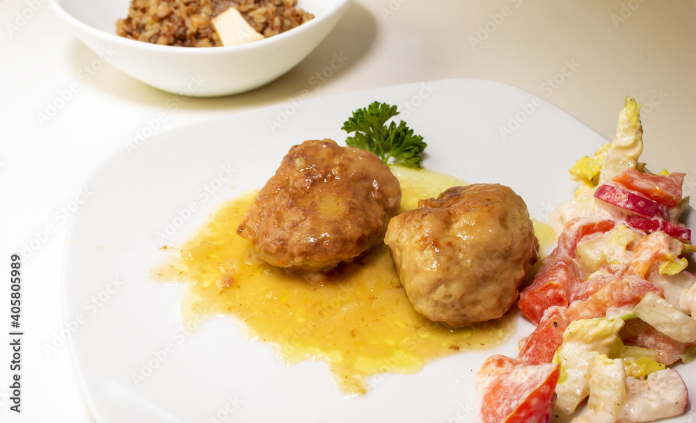 pork cutlets with buckwheat porridge garnish on a white background pork cutlets with buckwheat porridge garnish on a white background