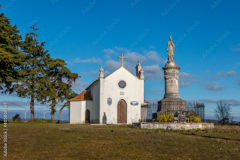 Church in the mountains with saint statue. Portuguese church in Torres Novas, Serra de Aire, Portugal
