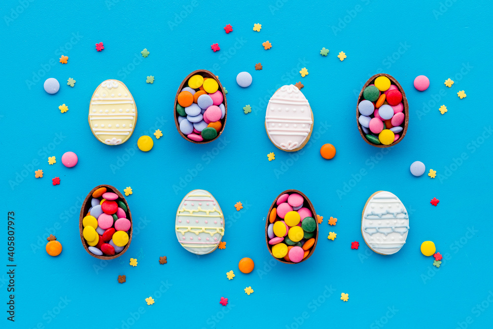 Happy Easter with chocolate eggs and sweets, top view Happy Easter with chocolate eggs and sweets, top view