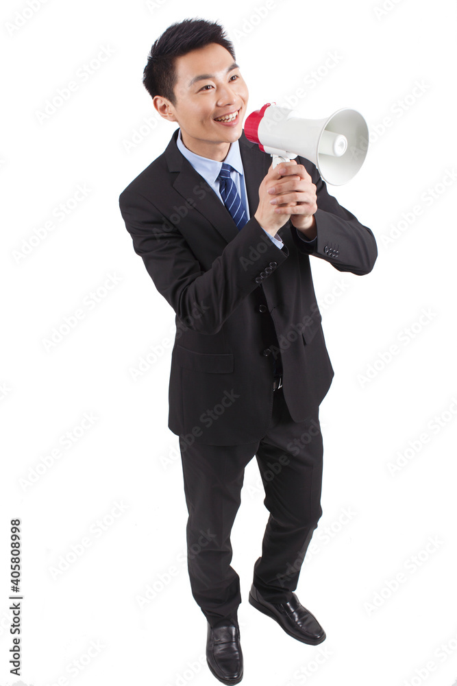 Portrait of young businessman shouting into Megaphone,close-up Portrait of young businessman shouting into Megaphone,close-up