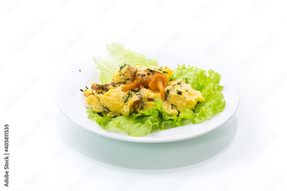 fried omelet with forest mushrooms chanterelles, on white background fried omelet with forest mushrooms chanterelles, on white background