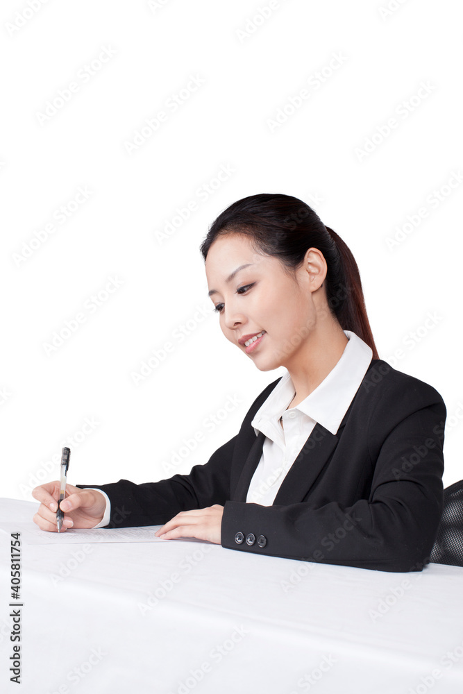 Businesswoman writting at a table with smile Businesswoman writting at a table with smile