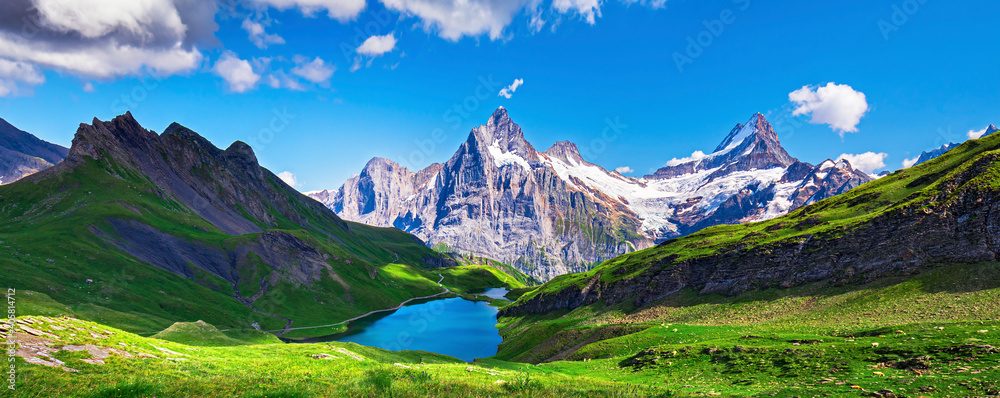 Sunrise view on Bernese range above Bachalpsee lake. Popular tourist attraction. Location place Swiss alps, Grindelwald valley, Europe.