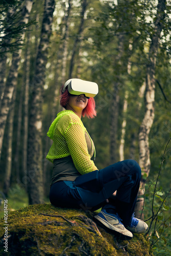 Woman goes into virtual reality using virtual reality headset.