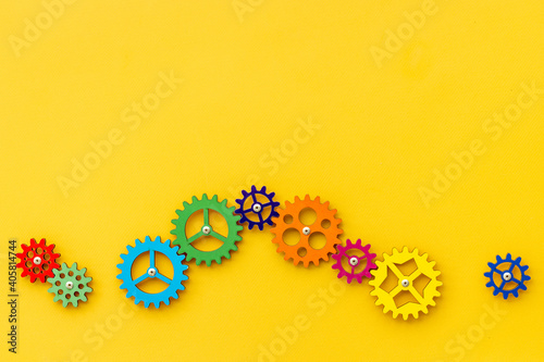 Teamwork concept. Gears connect in working mechanism, overhead view