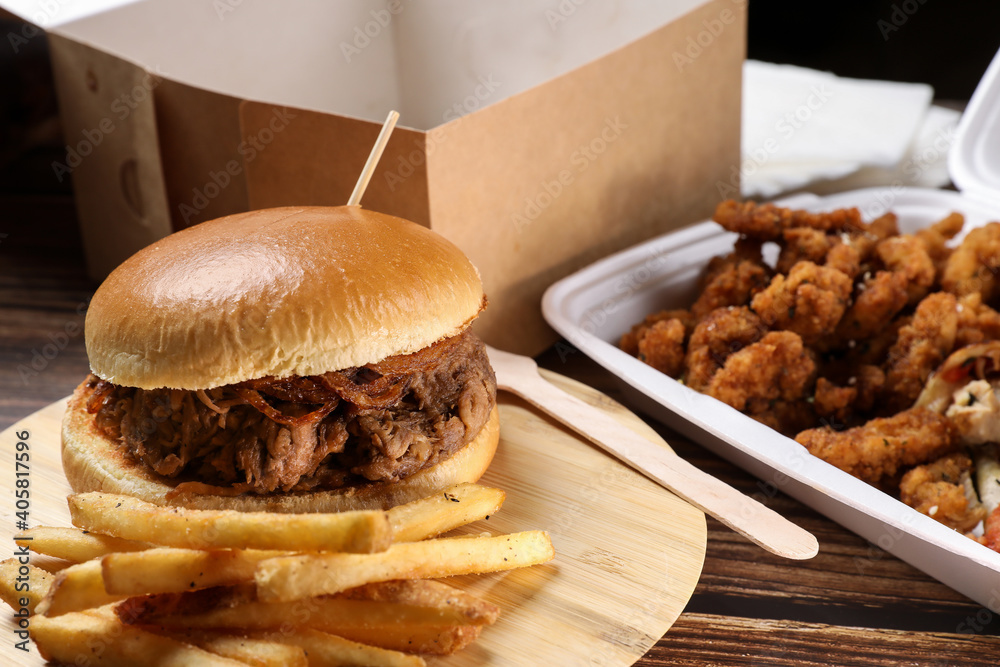 custom made wallpaper toronto digitalTop view of table full of food in plastic containers. Food delivery. Chicken salad, chicken wings with sous, burger on french fries on a wooden table. Business lunch.